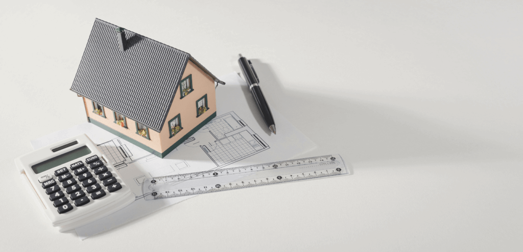 A picture of a home and calculator.